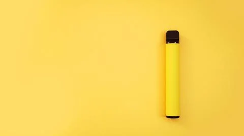 Yellow disposable electronic cigarette on bright yellow background Stock Photos