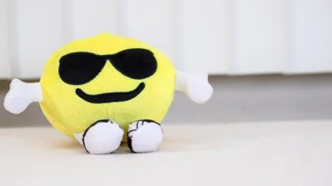 Yellow Doll On Table Stock Photos