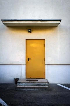 Yellow door in white wall Photos