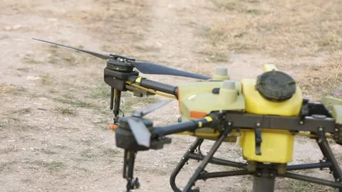 Yellow drone on the ground 2 Stock Footage 318848674