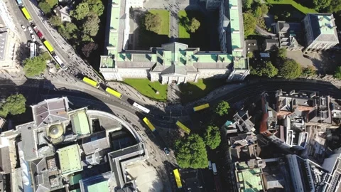 Yellow Dublin Buses and aerial look down to traffic on College St, Parliament Stock Footage 327489276