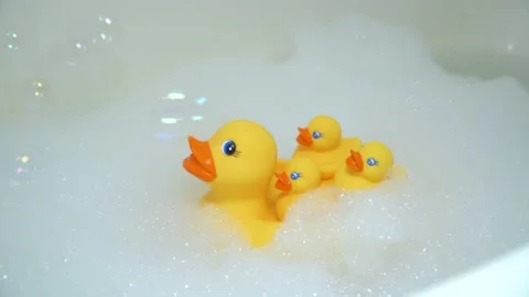 Yellow ducks swimming in the bath Stock Footage 132276363