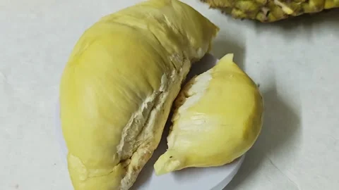 Yellow durian fruit on plate. Stock Footage 339337719