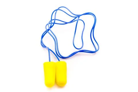 Yellow earplugs with blue band. Stock Photos