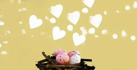 Yellow easter background with white foam hearts bokeh in blur Stock Photos