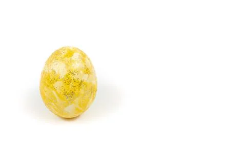 Yellow Easter egg decorated with glitter isolated on a white background. Shin Stock Photos