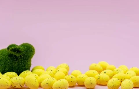 Yellow Easter Egg with freckles pattern and Rabbit Bunny on Pink Background 스톡 사진
