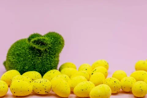 Yellow Easter Egg with freckles pattern and Rabbit Bunny on Pink Background 스톡 사진