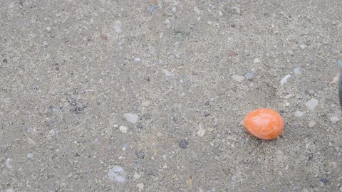 Yellow easter egg scrunched by a shoe Stock Footage 74724855