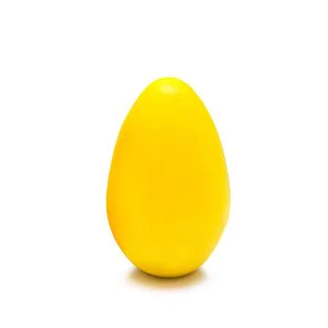 Yellow Easter egg on a white background. Close-up, isolate. Stock Photos