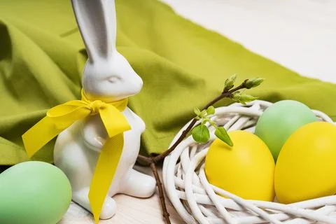 Yellow Easter eggs and blooming Daffodils in a pot Stock Photos