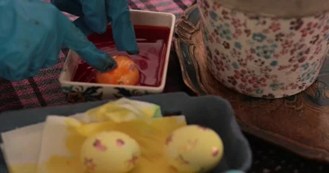 Yellow Easter eggs with stickers in the step of egg painting process for a Stock Footage 306067305