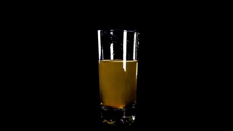 Yellow effervescent tablet falling in  glass of water1 Stock Footage 77287752