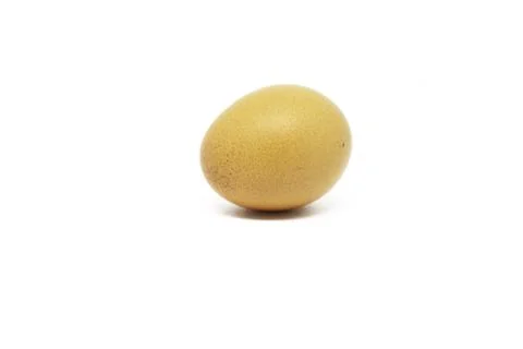 Yellow egg isolated on a white background. Stock Photos