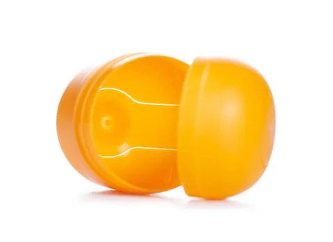 Yellow egg toy capsule Stock Photos