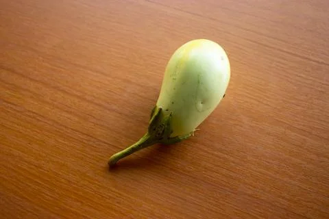 The yellow eggplant placed on the table is brown Stock Photos