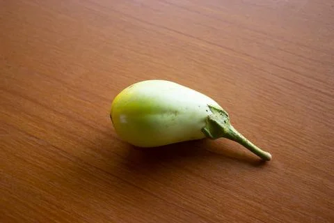 The yellow eggplant placed on the table is brown Stock Photos