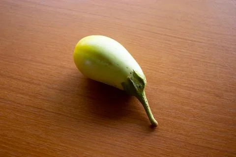 The yellow eggplant placed on the table is brown Stock Photos