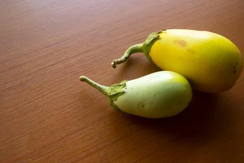 The yellow eggplant placed on the table is brown Stock Photos