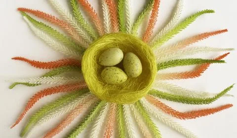 Yellow eggs in a wicker nest Stock Photos