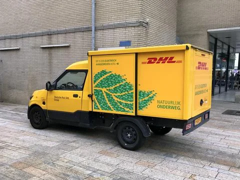 Yellow electrical DHL delivery van Stock Photos