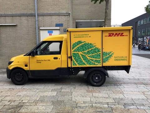 Yellow electrical DHL delivery van Stock Photos