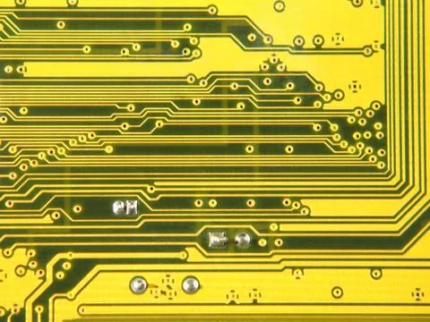 Yellow electronic microcircuit.background. Stock Photos