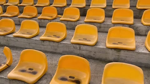 Yellow empty chair seats at stadium in pandemic time. Stay home. Stock Footage 143797586