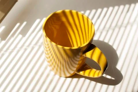 Yellow empty cup Stock Photos