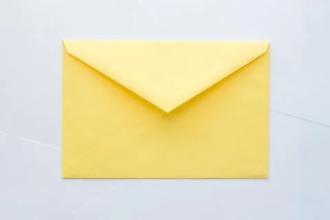 Yellow envelope on white background Stock Photos