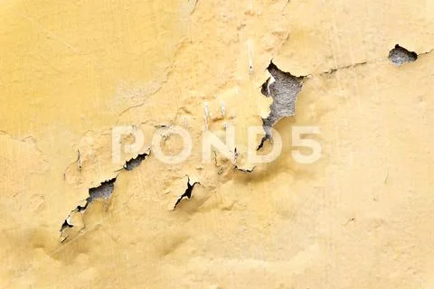 Yellow erode painted concrete wall,grunge rough texture background Stock Photos