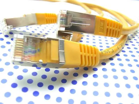 Yellow ethernet cable on dotted background yellow ethernet cable on dotted... 스톡 사진