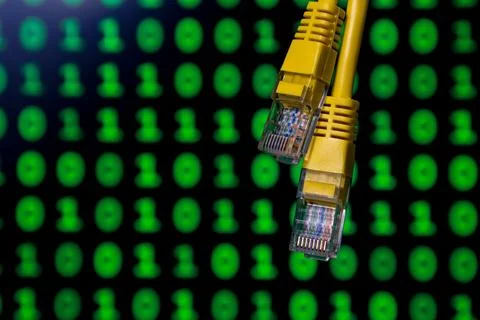 Yellow ethernet cables with digital binary code background Photos