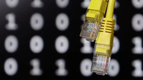 Yellow ethernet network cables with blurry digital background Stock Footage 344814171
