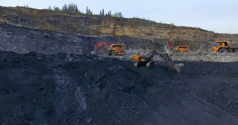 Yellow excavator digs coal 스톡 동영상 122076490