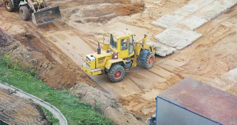 Yellow excavator is working at a construction site. Stock Footage 140137455