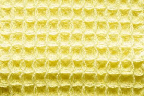 Yellow fabric background with cell pattern Stock Photos