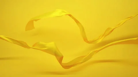 Yellow Fabric Clothes Flying in the wind on yellow background in slow motion Stock Footage 172191359