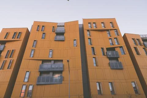 Yellow facade of a building from below Stock Photos