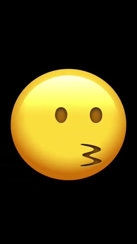 Yellow face with puckered lips on black background Stock Footage 329406124