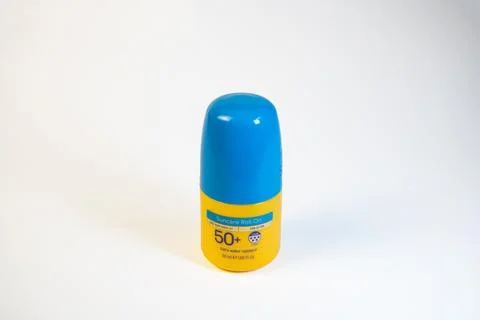 Yellow factor 50+ roll-on sunscreen with blue lid Stock Photos