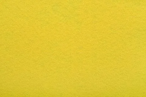 Yellow felt texture background - close-up of soft fabric surface. Stock Photos