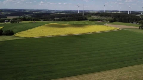 Yellow Fields and Wind Turbines drone shot Stock Footage 335760142