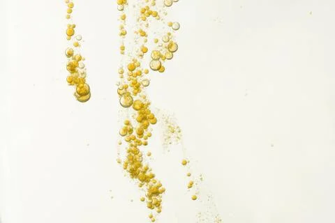 Yellow fizz bubbles Stock Photos
