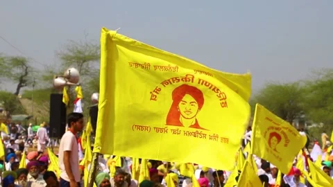 Yellow flag of shaheed bhagat singh during the farmers protest. Stock Footage 150649489