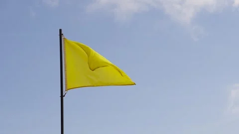 Yellow flag waving on the sky Stock Footage 249508638