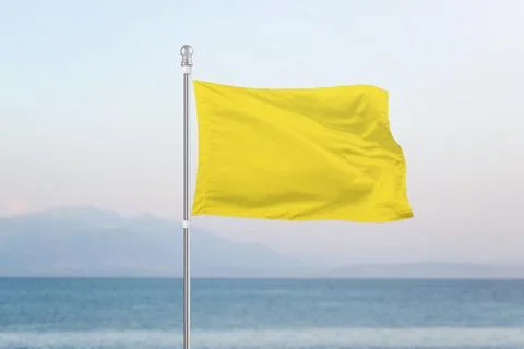 Yellow flag, which indicates moderate danger on beaches for swimming Stock Photos