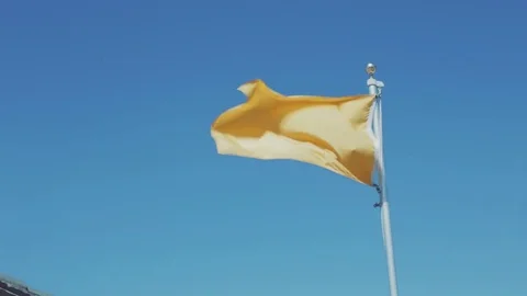 Yellow flag in Wind Stock Footage 77525159