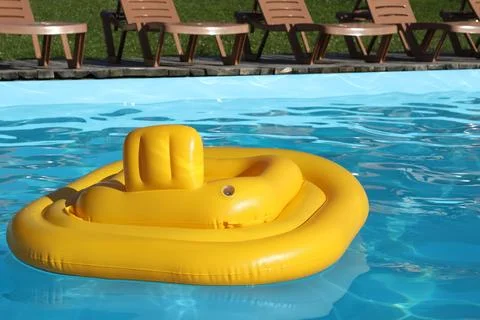 Yellow float in swimming pool at luxury resort Stock Photos