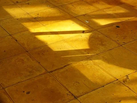 A yellow floor with a shadow on it. 写真素材